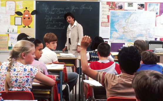 woman standing in front of children